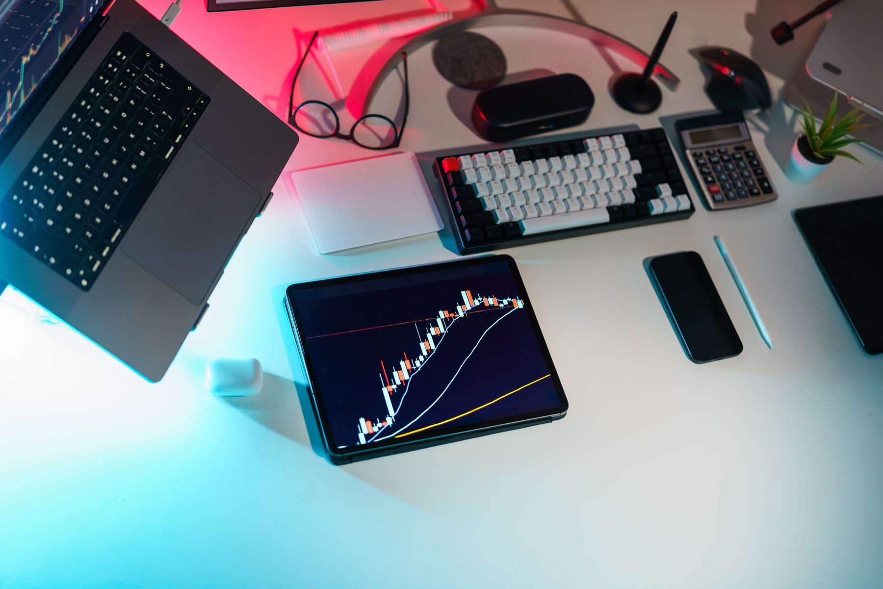 Multi-device stock-market workstation displaying live price charts